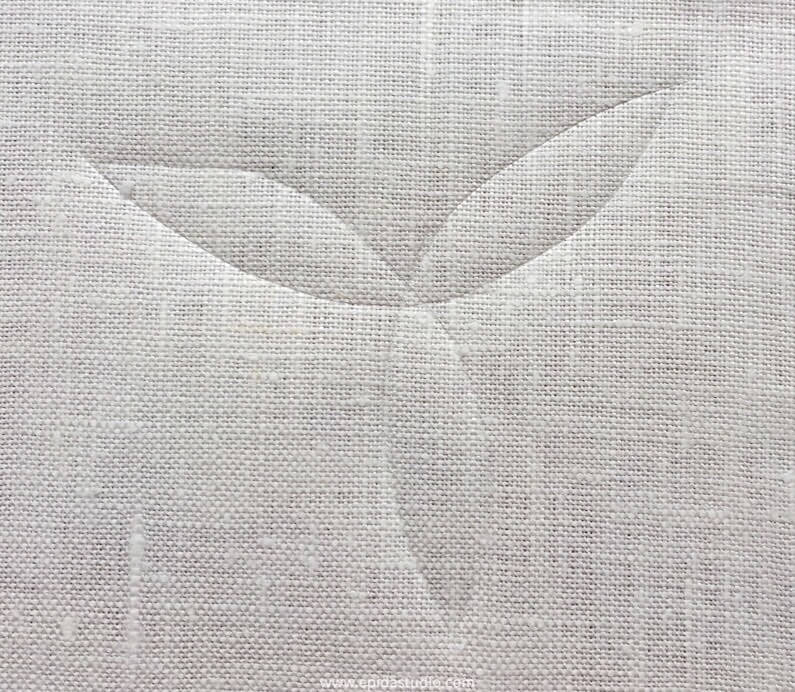 fabric with a design marked by a hera.