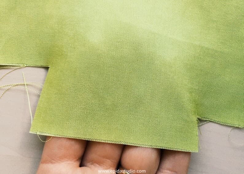 green silk on a hand.