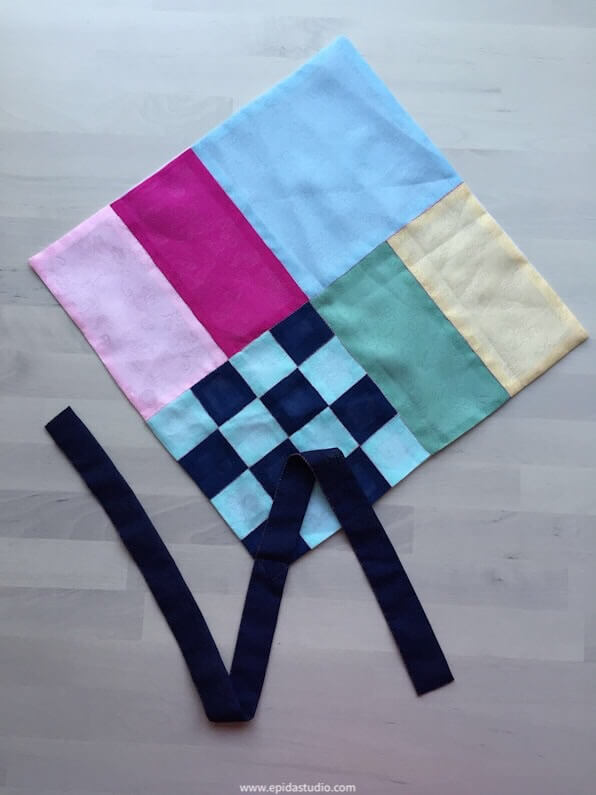 patchwork pojagi with tie open on a table