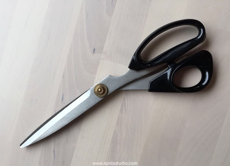 large shears with black handle.