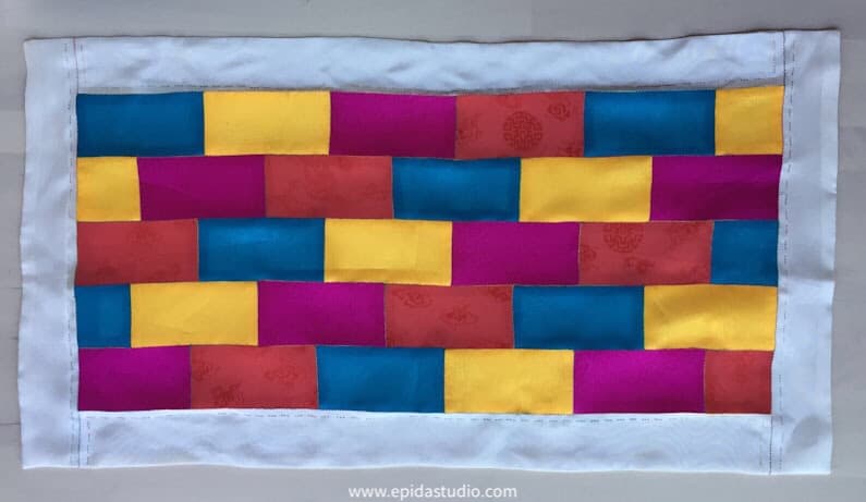patchwork mat made with bright colours of silk.