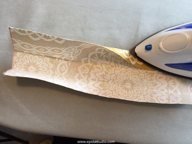 folding the fabric bag handle.
