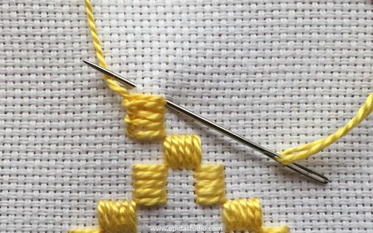 diagonal blanket stitch with yellow perle cotton.