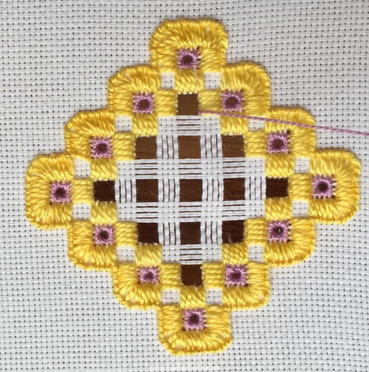 getting the thread ready to begin weaving bars in hardanger embroidery.