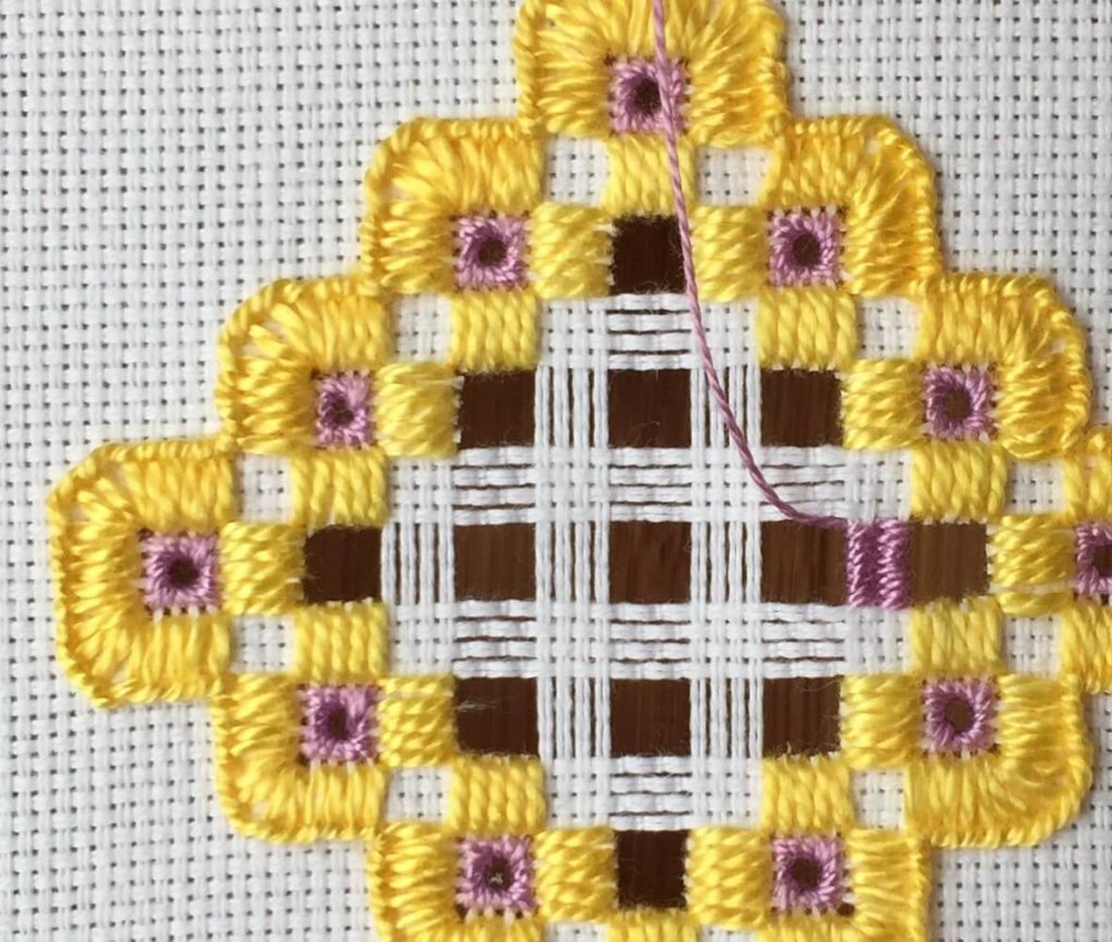 one bar woven in purple thread.