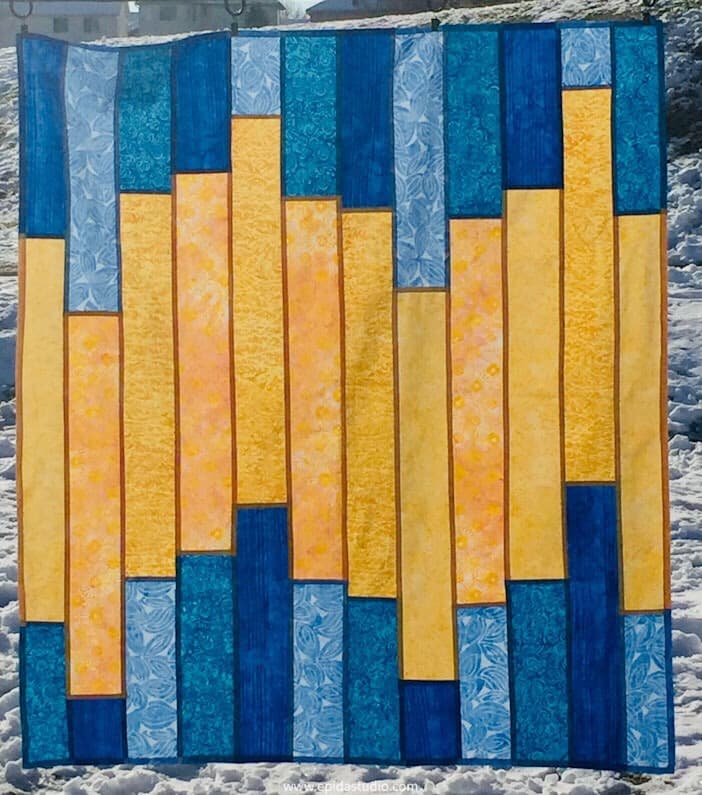 blue and yellow patchwork window covering