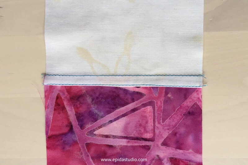 reversible pojagi seam with pink and white fabrics.