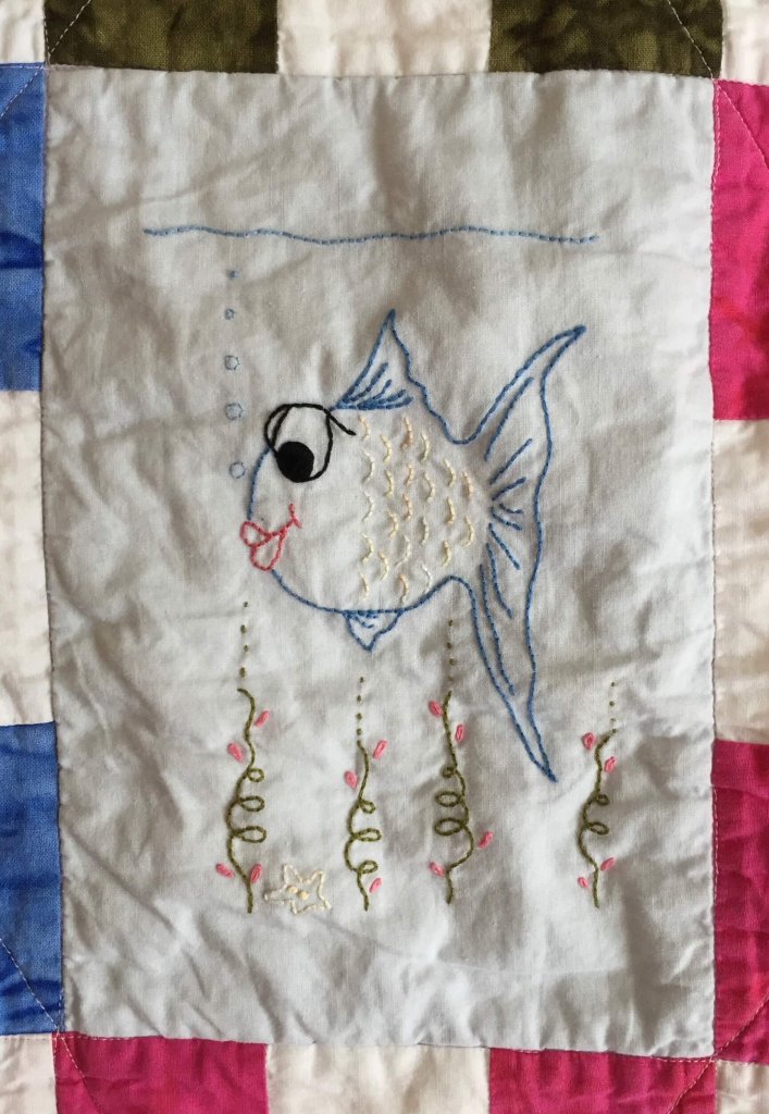 embroidered quilt block with fish and seaweed