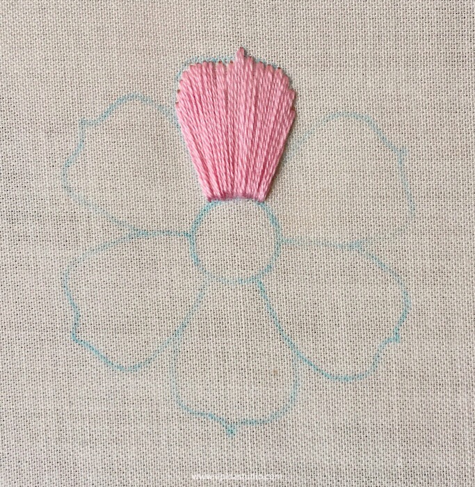flower motif embroidered with satin stitch