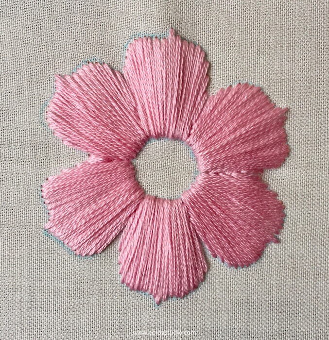 flower motif stitched with satin stitch