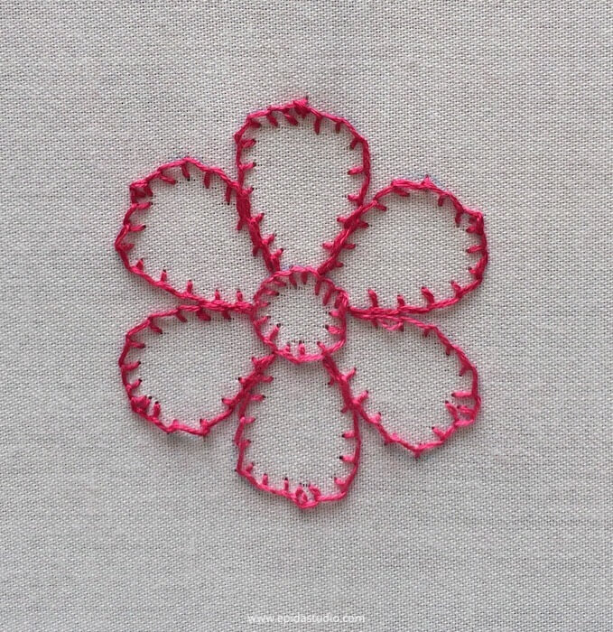 pink flower embroidered with blanket stitch