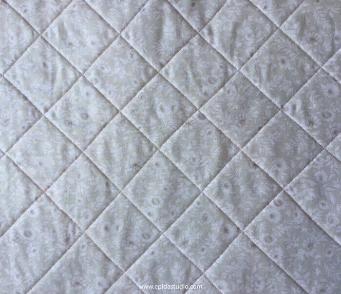 cross hatch quilting on white fabric