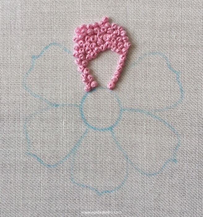 pink embroidery of a flower