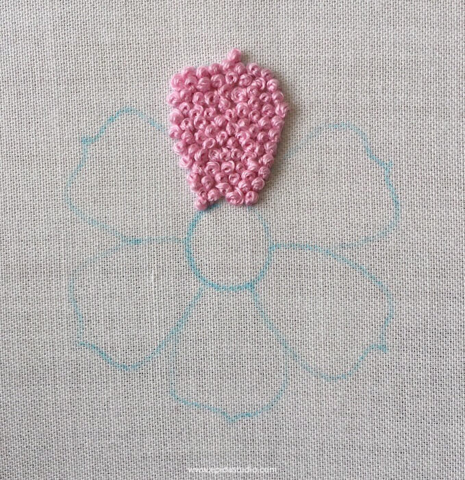 flower motif with one petal embroidered