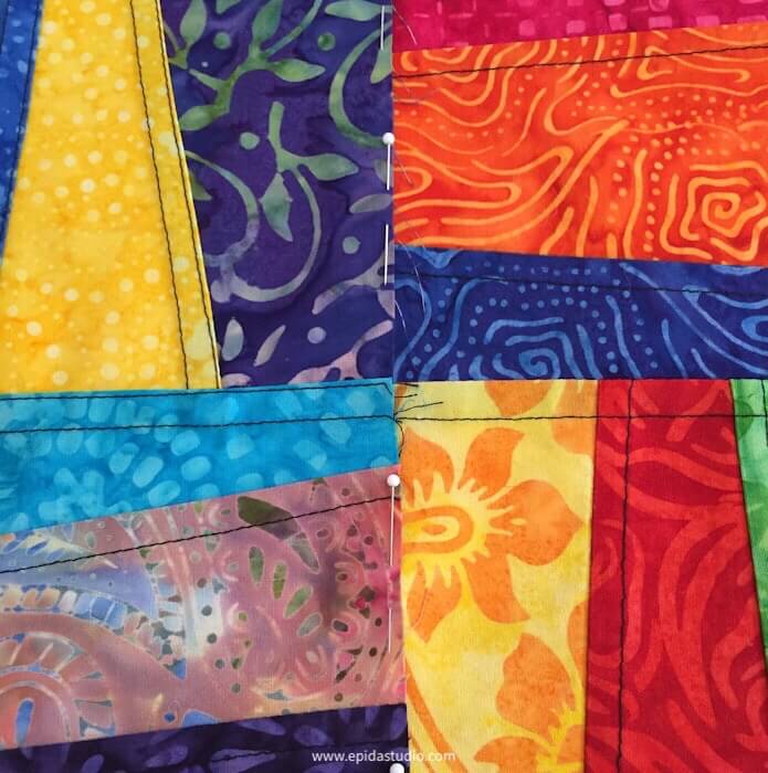 batik pojagi pieces pinned together for sewing