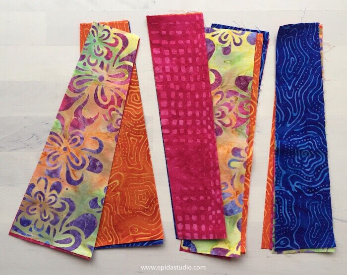 bright coloured batik fabric cut in pieces