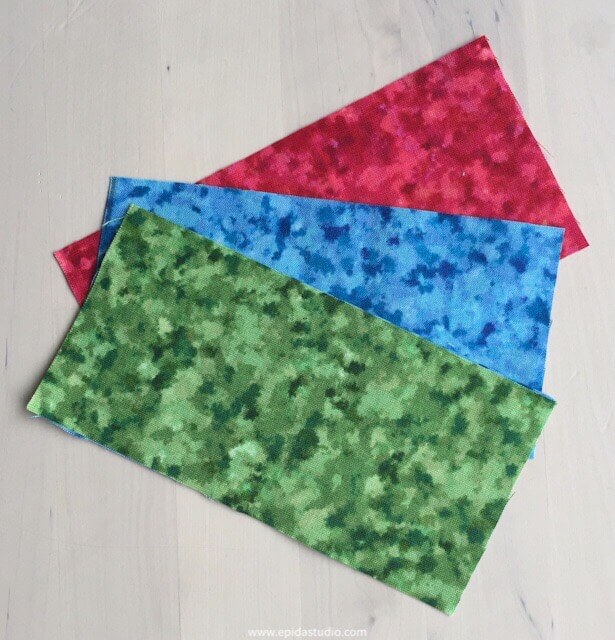 red, blue and green fabric pieces