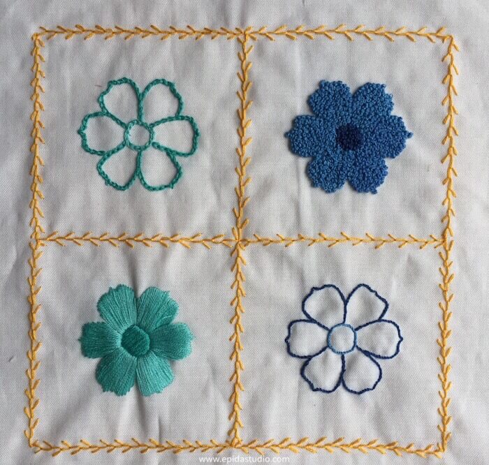 embroidered blue and aqua flowers with yellow border