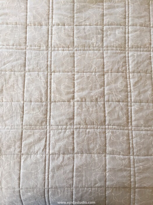straight line quilting on light grey fabric