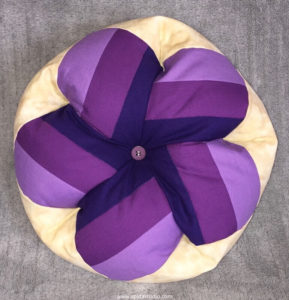 decorative pillow made with different values of purple fabric