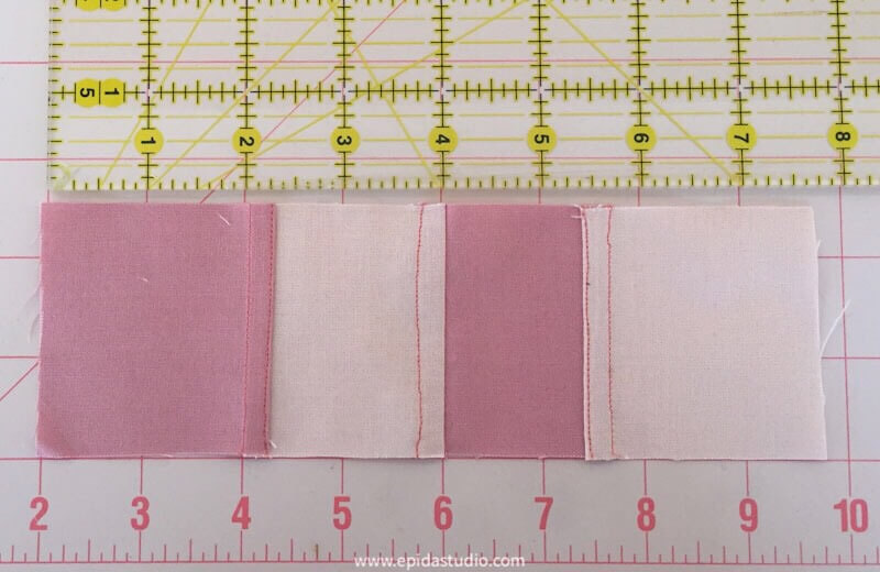 pink fabric squares joined with pojagi seam
