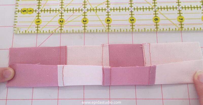 strip of fabric pieces joined with pojagi seam.