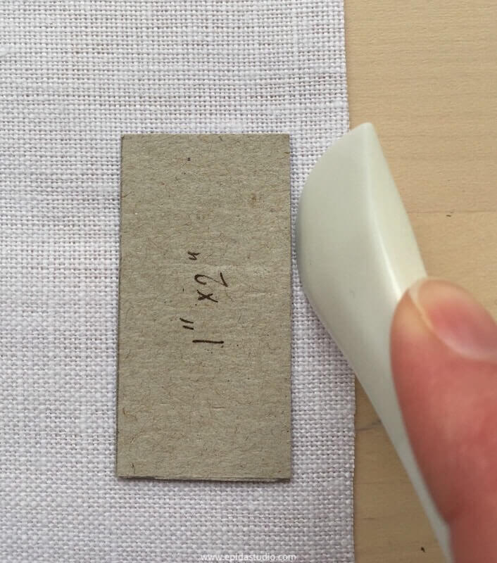 using a hera to trace a template and mark a shape on fabric