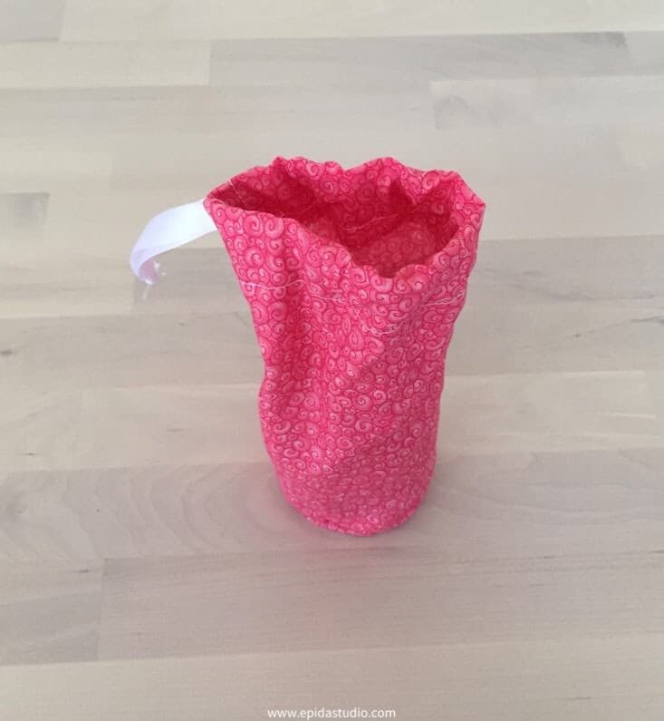 open small pink drawstring bag.
