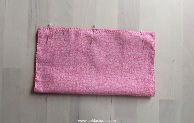 pinning the side seam of the bag for stitching.