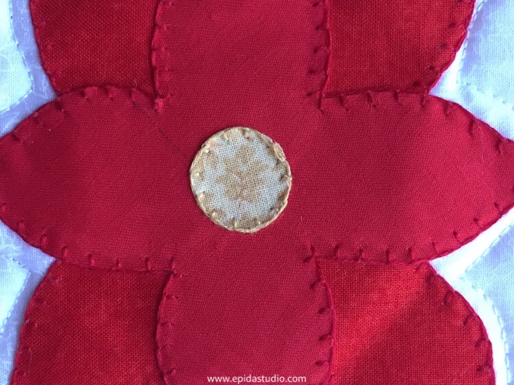 close up of hand embroidery on applique.