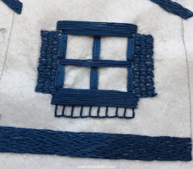 blanket stitch hand embroidery in a house picture.