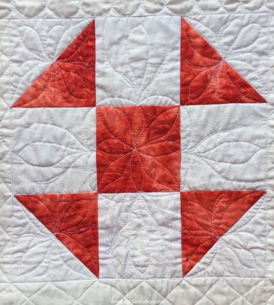 close up of quilting on a shoo fly block.