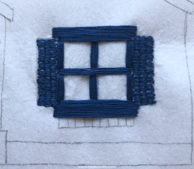 embroidery satin stitch trim on a window.