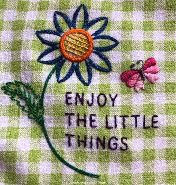 embroidered design on tea towel.