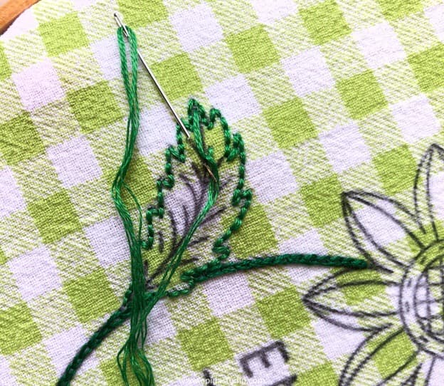 stitching a leaf.