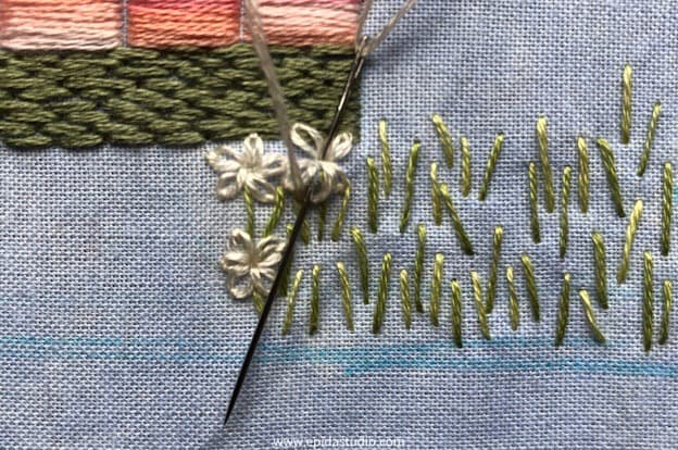 stitching lazy daisy flowers.
