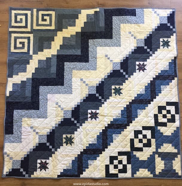 blue and white log cabin sampler quilt.