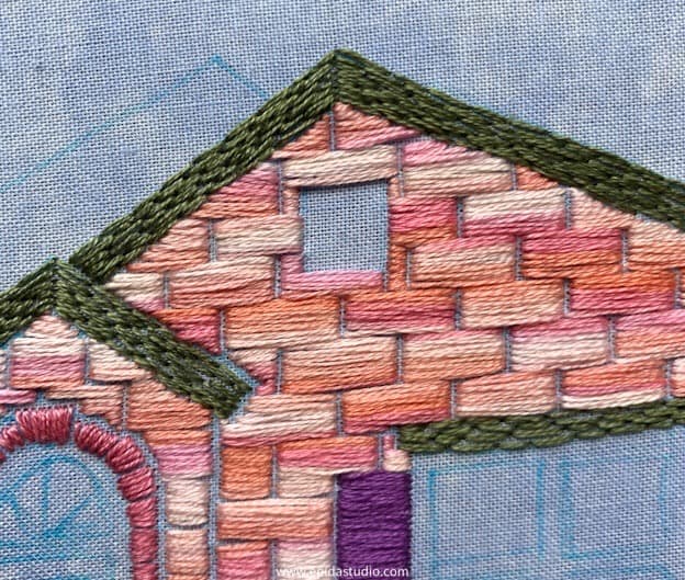 long and short stitch embroidery close up.