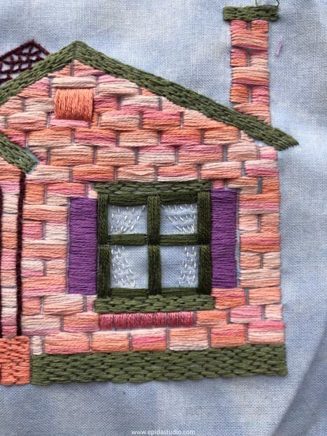 close up of window in house embroidery.