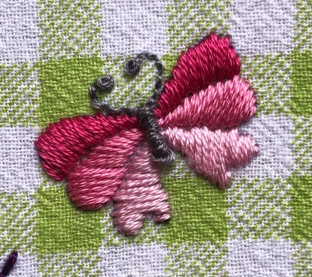 butterfly embroidered with satin stitch.