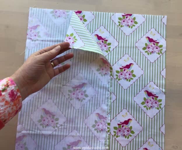 placing fabric right sides together for pillow cover.