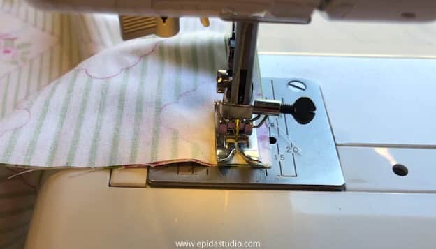 sewing machine stopping to turn a corner on the pillow cover.