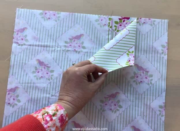 pinning the back fabric onto the front.