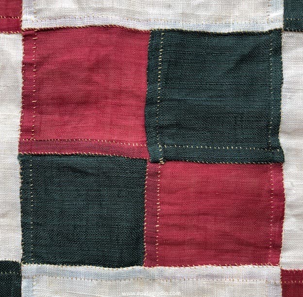 close up of reversible patchwork stitching.