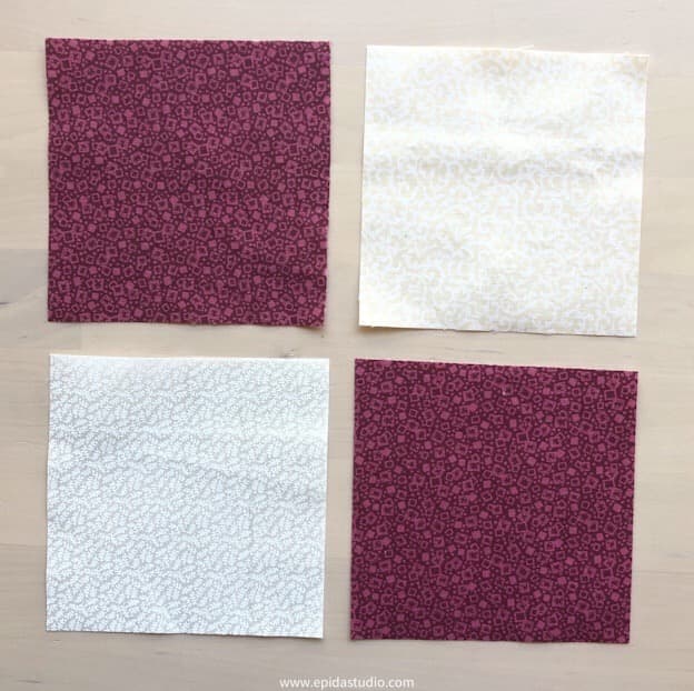 four squares of fabric.