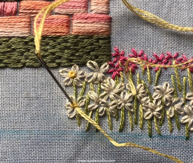 stitching french knots as flower centres.