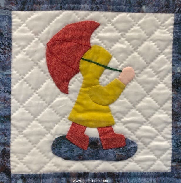 sunbonnet sue with umbrella.