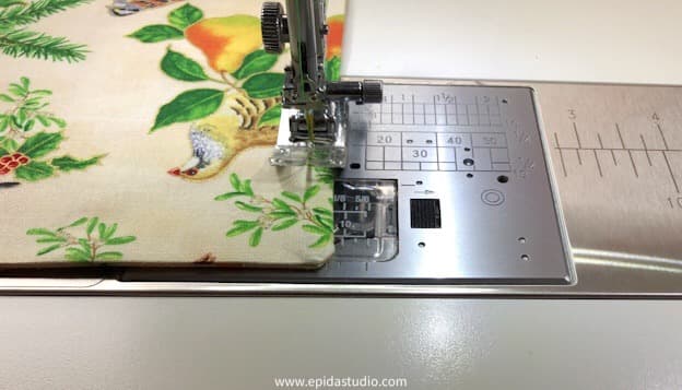 topstitching the edge of the placemat.
