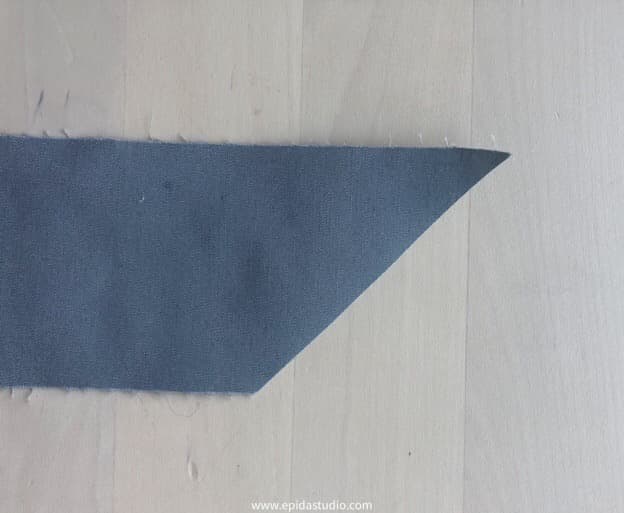 fabric strip with a 45* cut at the end.