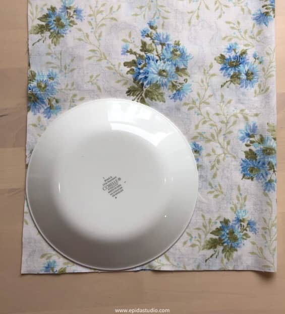 using a plate to trace a curve on the corner.